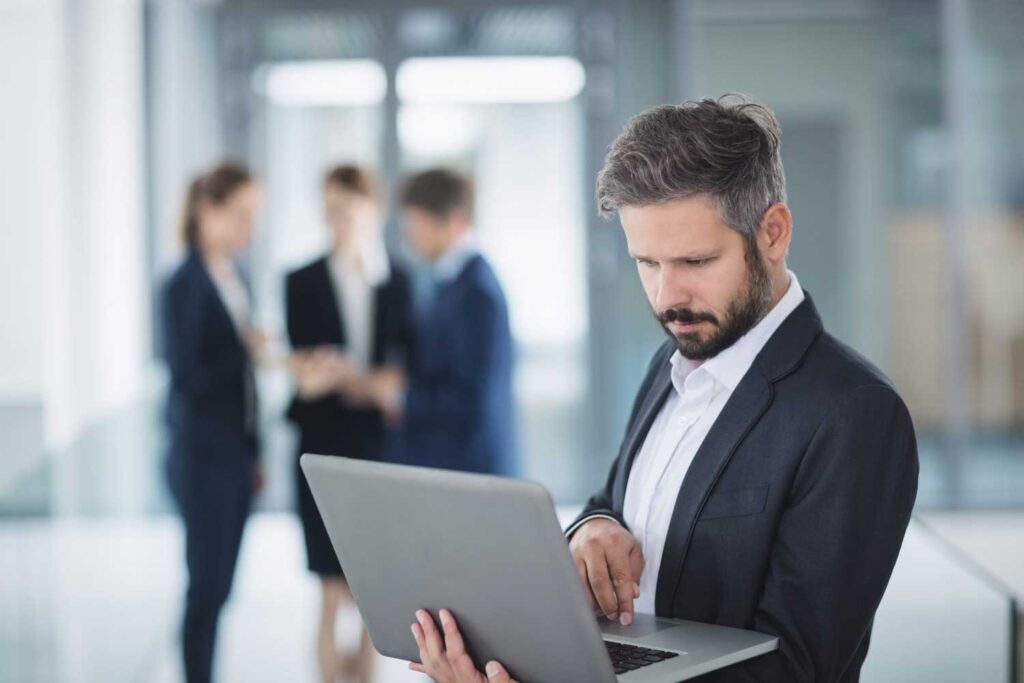 A man looking at laptop - e commerce marketing